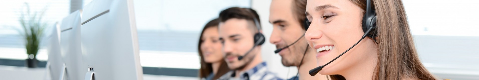 Landing page hero image of call center staff responding to customers. 